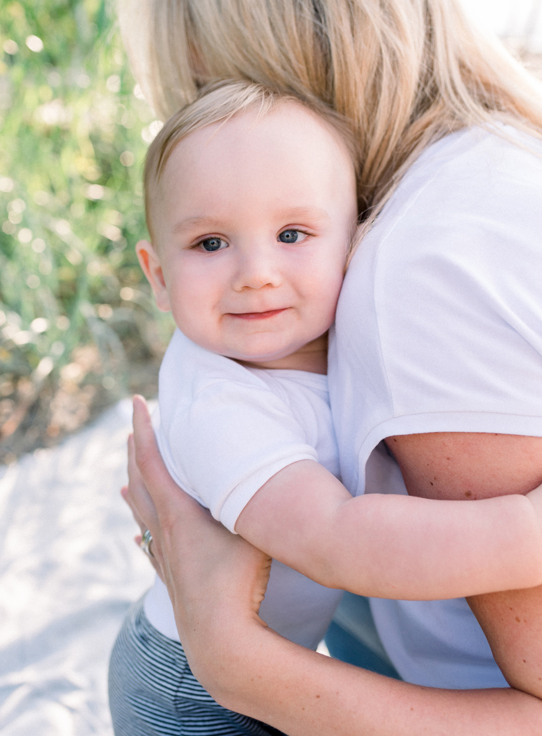 Cute baby hugging his mom