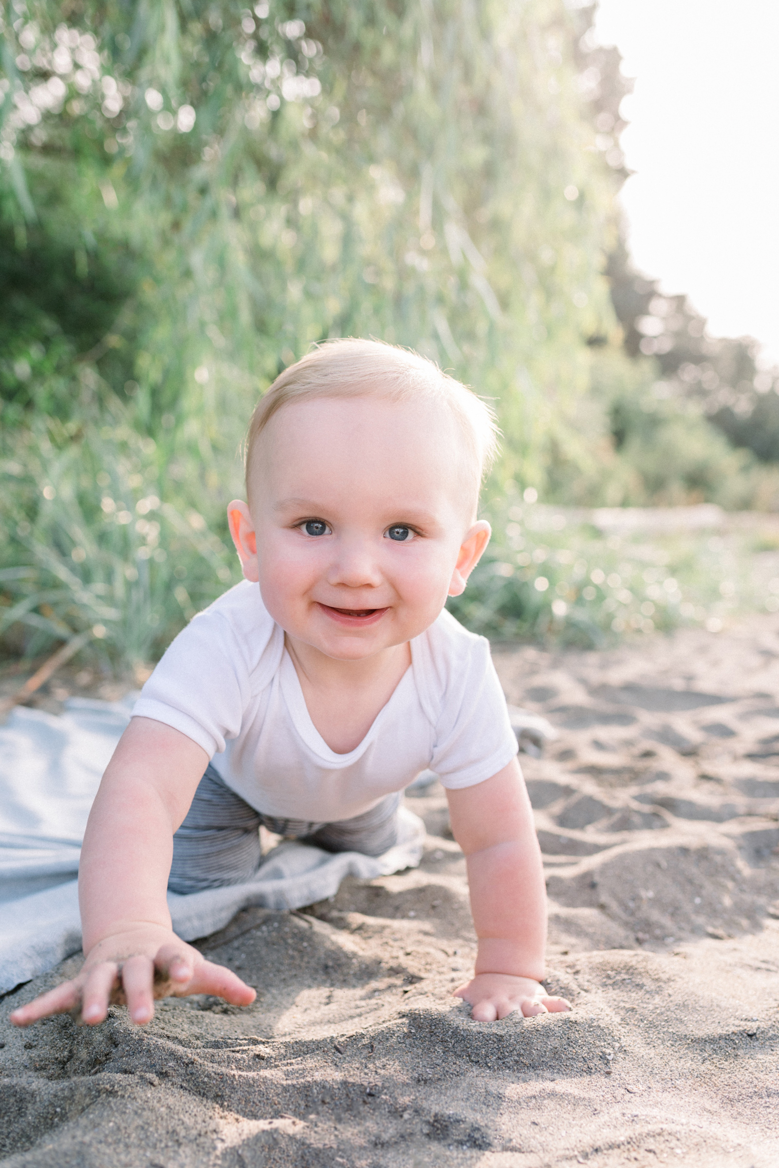 Cute baby crawling on the beach