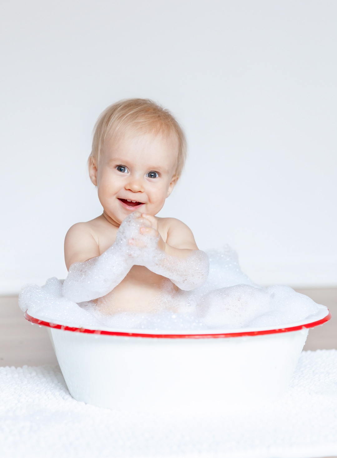 Fun baby photo session with baby in a tub Sunshine Coast BC