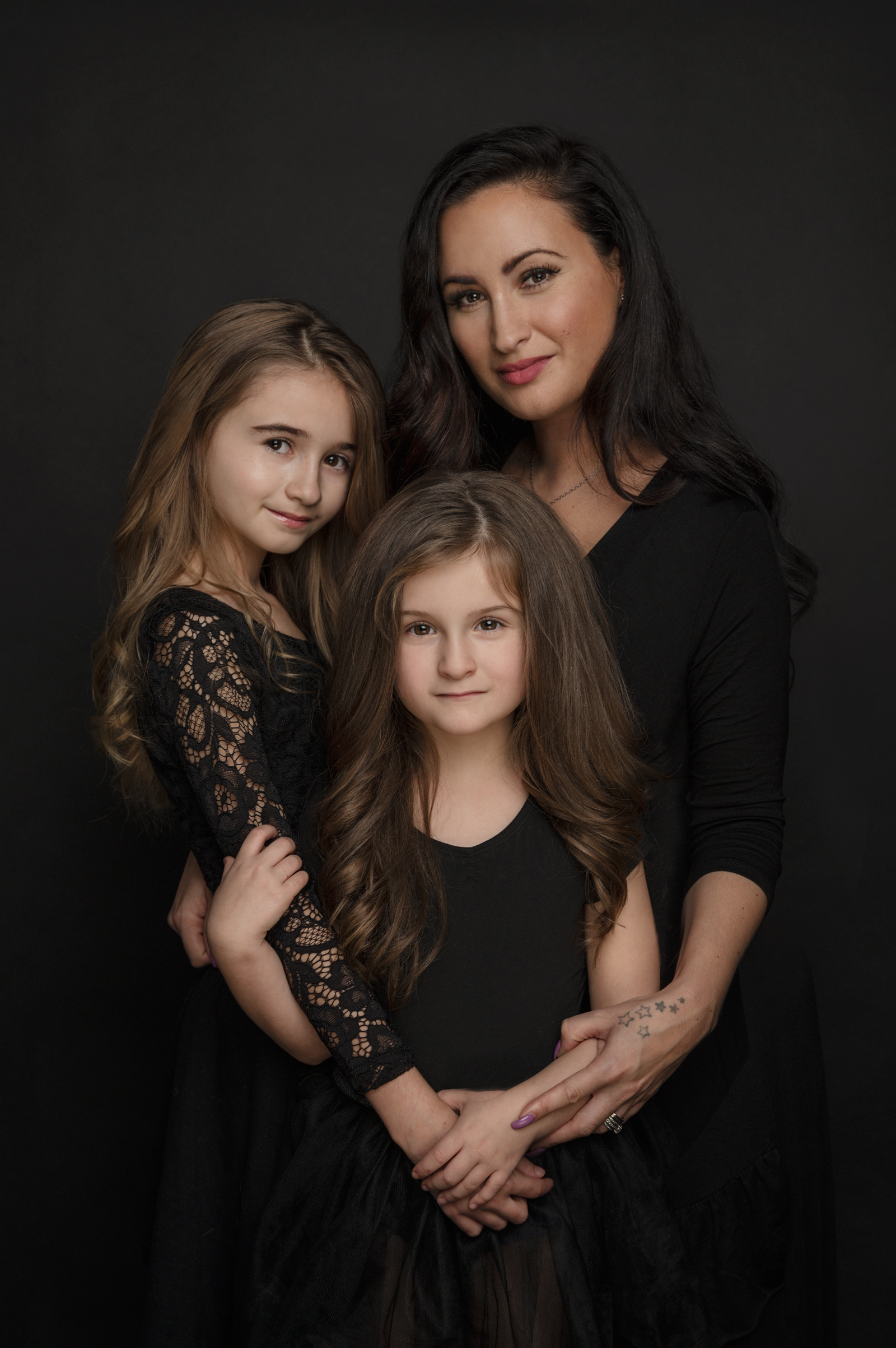 Mother and two daughters painterly family portrait in Vancouver BC studio.