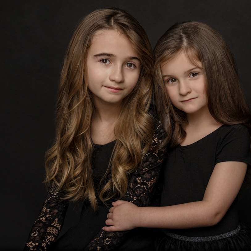 Siblings sisters portraits in studio black background high quality portrait Sunshine Coast BC