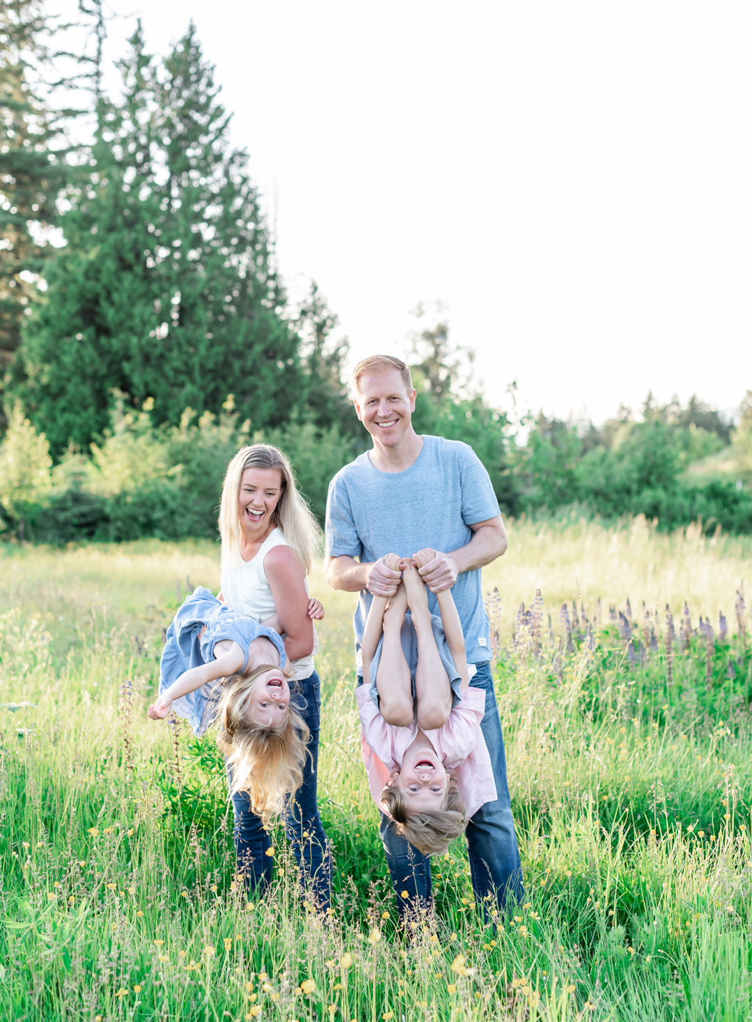 Canid playful family photos in a field Vancouver