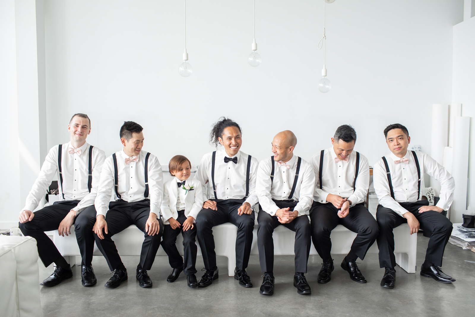 Grooms black and white suits getting ready photos in Gastown Vancouver