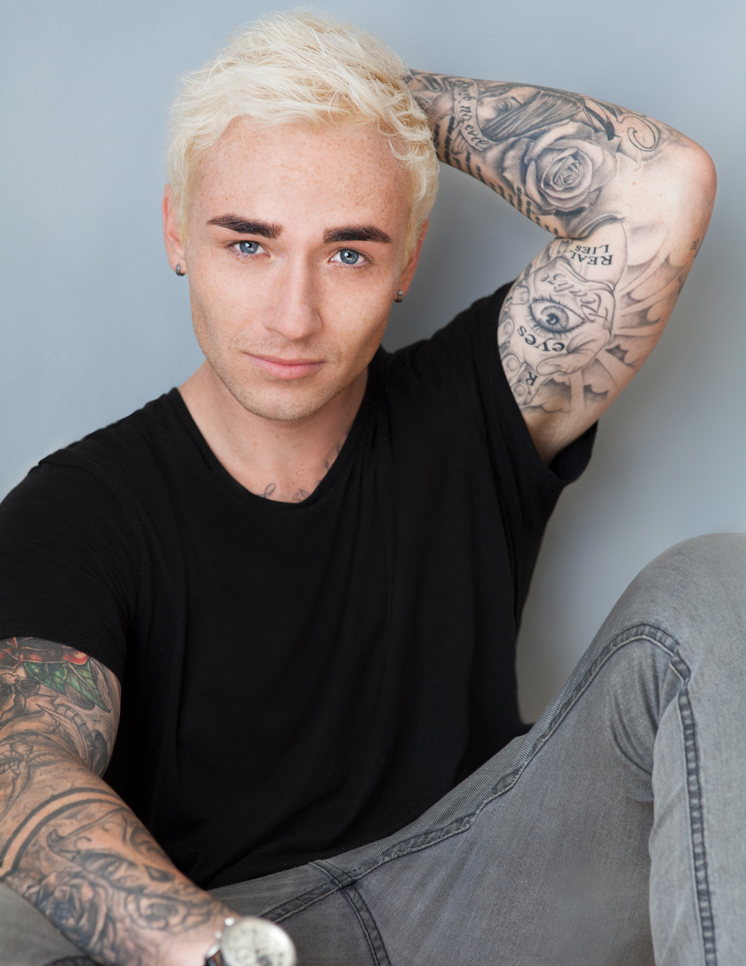 South African male actor Myles Cobbett with tatoos