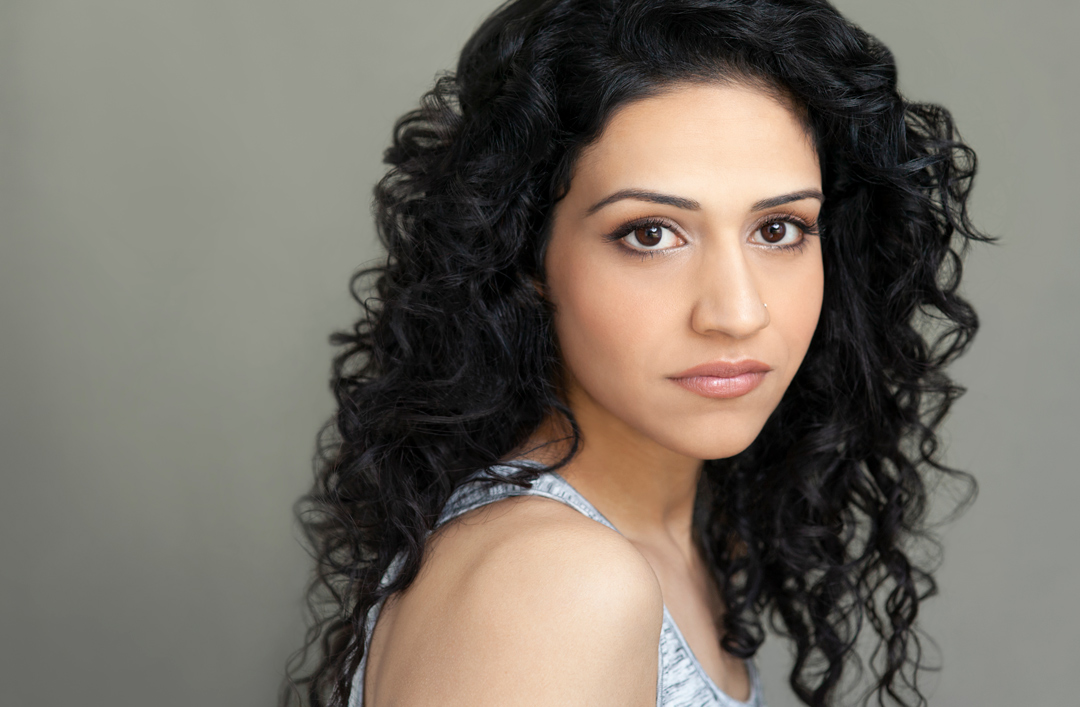 Ethnic actress with natural curly hair headshot